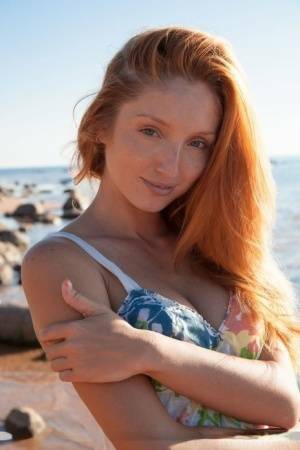 Hot redhead Michelle H flaunting her big tits & tight pussy on the beach on chickinfo.com