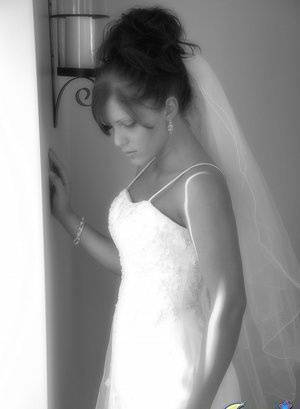 Young amateur wears her hair done up while modelling bridal wear on chickinfo.com