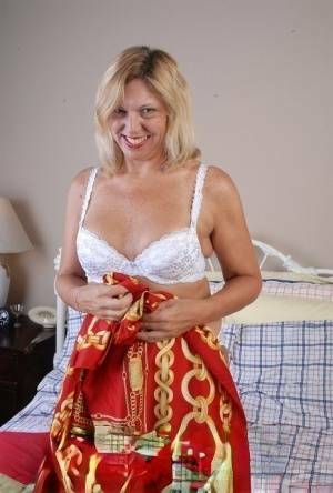 Older blonde lady removes hot white lingerie set for cunt masturbation on chickinfo.com