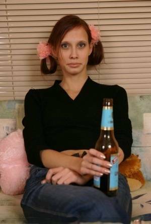 Young redhead chugs a beer before having sex with an older man on chickinfo.com