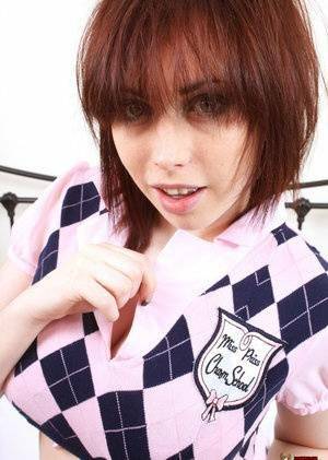 Louisa stripping off her schoolgirl uniform on chickinfo.com