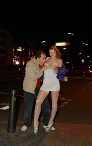 Slutty LaMia in white stockings topless sucks on her knees in the street on chickinfo.com