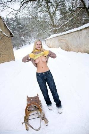 Busty blonde bares big tits in the snow & sucks POV for mouthful of cum on chickinfo.com