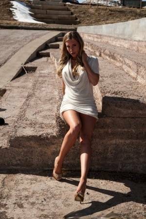 Hot blonde in white dress flashes pierced tits & naked pussy upskirt outdoors on chickinfo.com