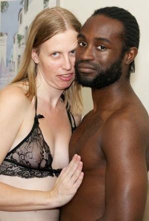 White amateur deepthroats her black lover's cock in lingerie ensemble on chickinfo.com