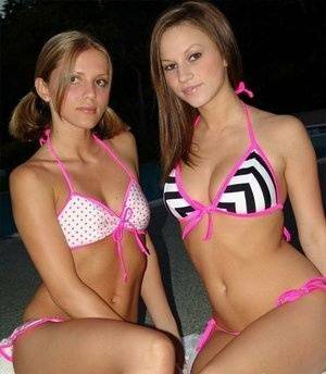 Young lesbians take off their bikinis in a safe for work manner at night on chickinfo.com