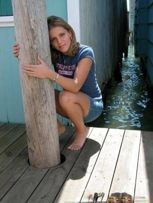 Blonde solo girl flashes upskirt panties on lakeside boardwalk on chickinfo.com