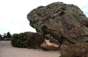 Amateur chick poses totally nude in running shoes near huge boulders on chickinfo.com