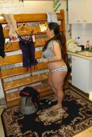 Fat amateur Kimberly Scott changes into lingerie inside a XXX store on chickinfo.com