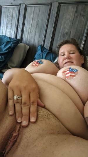 Overweight amateur Busty Krisann poses in the nude around her home on chickinfo.com