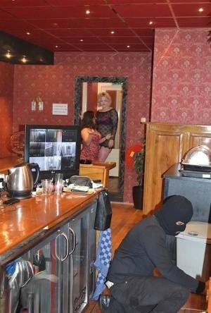 Amateur chick Kimberly Scott and a girlfriend disrobe a hooded male robber on chickinfo.com