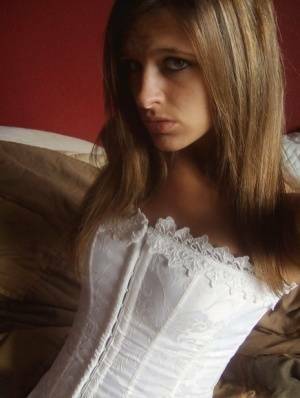 Teen in white corset and tight panties showing off her perfect tight body on chickinfo.com
