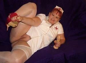 Mature redheaded nurse Valgasmic Exposed exposes herself during dildo play on chickinfo.com
