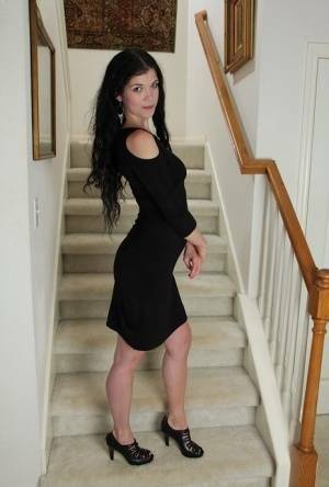 Clothed milf beauty Veronica Stewart is taking off her black dress on chickinfo.com