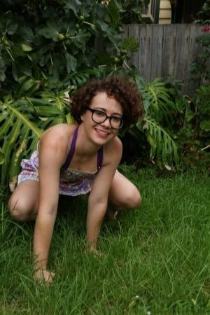 Geeky girl Rosie wears her glasses for her nude debut on the back lawn on chickinfo.com