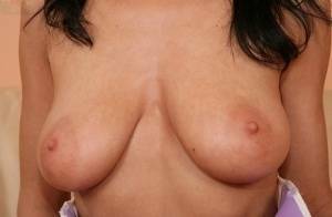 European babe freeing big MILF tits from uniform before masturbating on chickinfo.com
