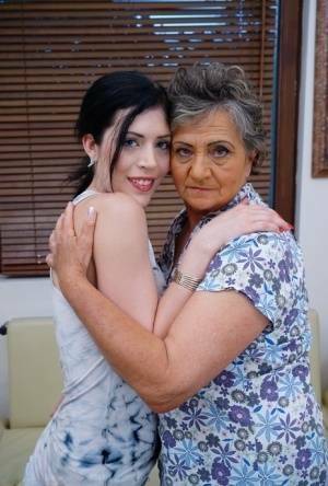 Lesbian granny worshipping sexy teen's attractive body and holes on chickinfo.com