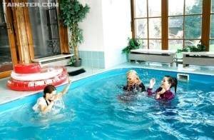 Playful fetish ladies have some fully clothed fun in the pool on chickinfo.com