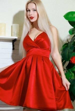 Nice blonde teen Genevieve Gandi removes red dress to display her trimmed muff on chickinfo.com