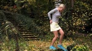 Cute blonde Victoria Pure hikes her skirt to take a pee along country lane on chickinfo.com