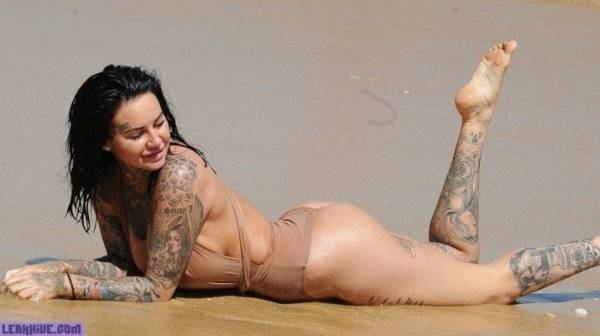 Jemma Lucy showing her ass and cleavage on the beach on chickinfo.com