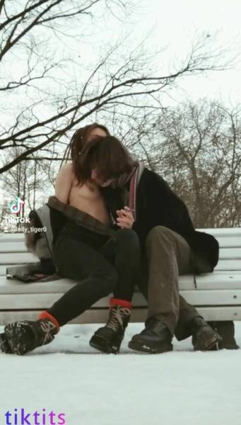 Two underage 18+ TikTok girls have fun in a snowy park and suck each other's virgin nipples nsfw on chickinfo.com