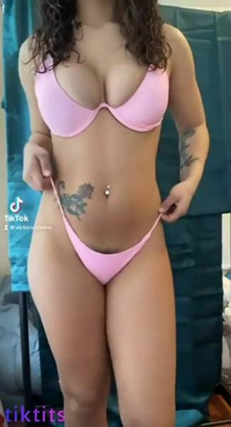 Girl in a swimsuit for TikTok sexy chic twists her tight ass on chickinfo.com