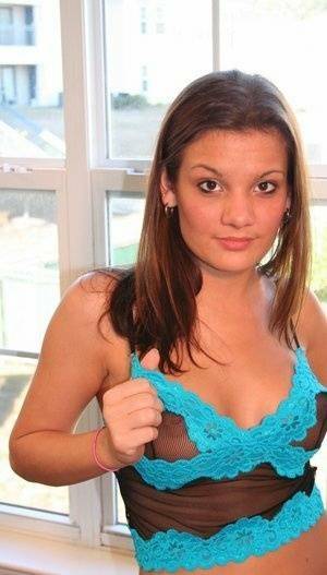 Young amateur Kate Crush places her hand over her exposed breasts on chickinfo.com