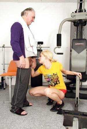 Young fitness chick in pigtails sucks off a much older man's cock on chickinfo.com
