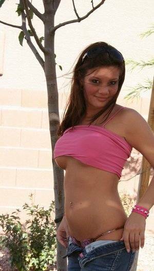 Amateur chick Kate Crush sets her perky tits free outdoors in denim jeans on chickinfo.com