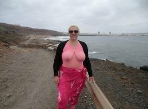 Aged lady Barby looses her big tits from a crotchless bodystocking by the sea on chickinfo.com