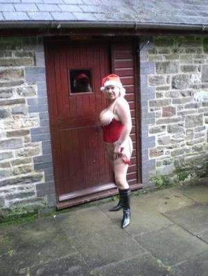 Blonde amateur Barby releases her big tits and butt from Xmas lingerie outside on chickinfo.com