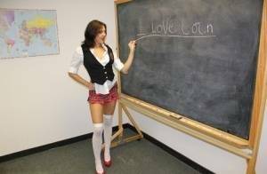 Naughty schoolgirl Cherry Poppins seduces a fellow student in slut wear on chickinfo.com