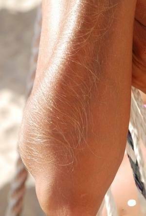 Amateur model Lori Anderson shows her hairy arms in a bikini and sunglasses on chickinfo.com