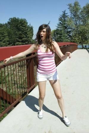 Flexible babe in shorts Holly Michaels shows her sports body outdoor on chickinfo.com