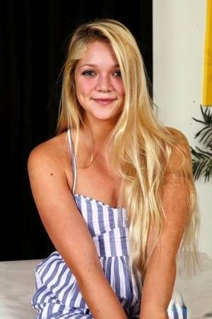 Young blonde Jessie Andrews is all aglow after a fuck and open mouth facial on chickinfo.com