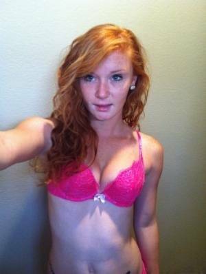 Natural redhead Alex Tanner slips off her pink lingerie set for nude selfies on chickinfo.com