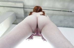 Young redhead Dolly Little revealing shaved pussy in pigtails and socks on chickinfo.com