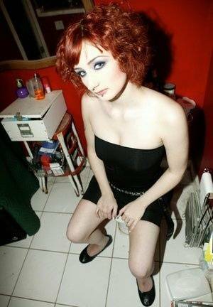 Pale redhead Violet Monroe gets naked in flat shoes while in a bathroom on chickinfo.com