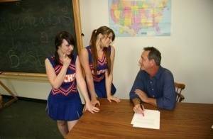 2 cheerleaders jerk off their geography teacher on top of his desk on chickinfo.com