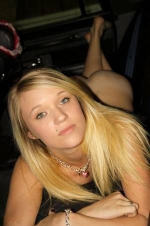 Blonde amateur Teagan slides lace panties aside to get naked inside a vehicle on chickinfo.com