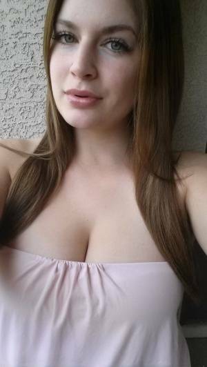 Plump amateur Danielle takes topless and clothed selfies around the house on chickinfo.com