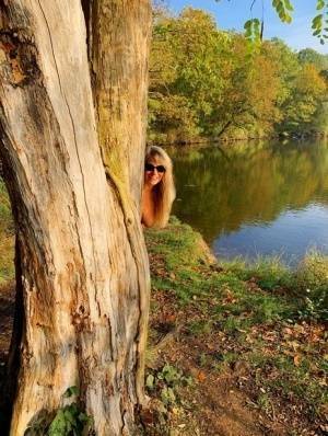 Blonde amateur Sweet Susi models naked in black leather boots near a lake on chickinfo.com