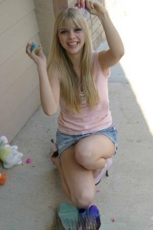 Sweet blonde teen Jana Jordan flashes upskirt panties while eating chocolate - Jordan on chickinfo.com