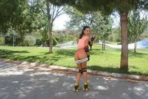Latina solo girl Carolina Abril shedding shorts to expose nice ass outdoors on chickinfo.com