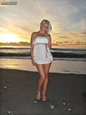 Hot blonde Anikka Albrite strips naked at the beach before nude hitchhiking on chickinfo.com