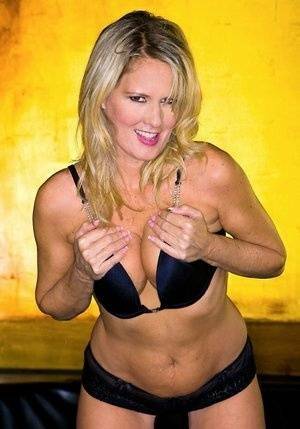 Blond MILF Bridgett Lee flaunting with her tits and big ass exposed on chickinfo.com