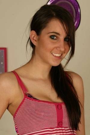Young brunette Stacy H gets completely naked on a wooden table on chickinfo.com