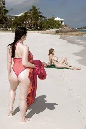 Fervent lesbians stripping nude and playing with dildos on the beach on chickinfo.com