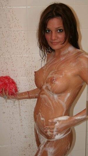 Teen amateur Kate Crush soaps her perky breasts while taking a shower on chickinfo.com